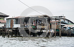 Ramshackle house of poor family on the water