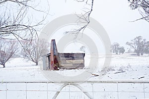 Ramshackle rustic shack in snowy rural scene