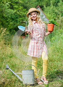 Ranch girl. Happy childhood. Planting plants. Little kid hold flower pot. Spring country works. Happy childrens day