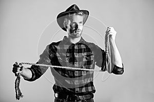 Ranch occupations. Lasso is used in rodeos part competitive events. Lasso can be tied or wrapped. Western life. Man photo