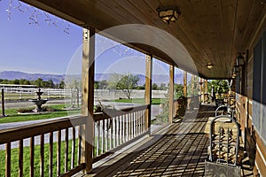 Ranch porch overlooking horse stables