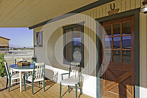 Ranch porch overlooking horse stables