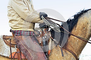 Ranch work on horseback on a snowy day.