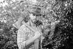 rancher with axe outdoor, copy space. photo of rancher with axe. rancher with axe.