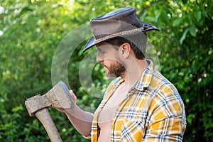 rancher with axe outdoor. image of rancher with axe. rancher with axe. rancher with axe