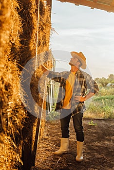 Rancher in boots, straw hat and