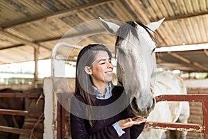 Rancher Feeding Hungry Horse