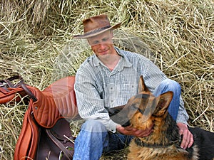 Rancher and his dog relaxing at the farm