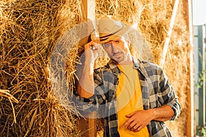 Rancher in shirt looking at camera