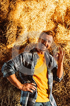 Rancher in shirt showing okay gesture