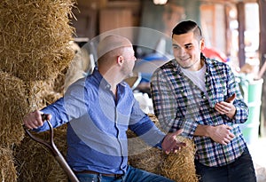 Ranchers talking in a shed