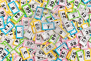 A random array of multicoloured raffle tickets photo