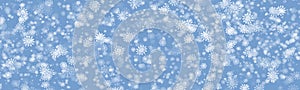 Random falling snow flakes wallpaper. Snowfall dust freeze sky, blue background. Many snowflakes