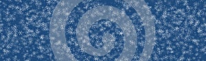 Random falling snow flakes wallpaper. Snowfall dust freeze sky, blue background. Many snowflakes