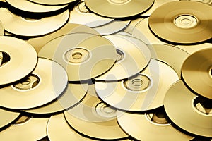 Abstract background of gold metallic DVD and CD optical storage disks