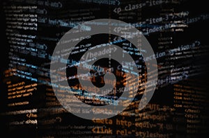 Cluttered random HTML codes for website development. White, yellow, and blue gradient effect in black background for overlay.