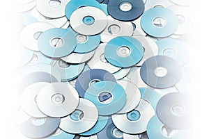 Random layers of silver blue CD and DVD optical disks data concept