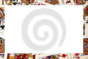 Random playing cards of kings, queens and jacks together forming a background