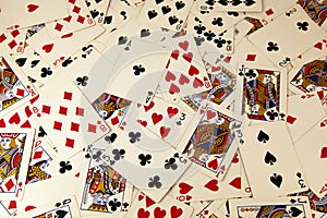 Random playing cards together forming a background