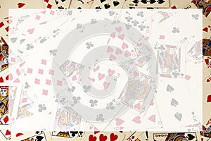 Random playing cards together forming a background