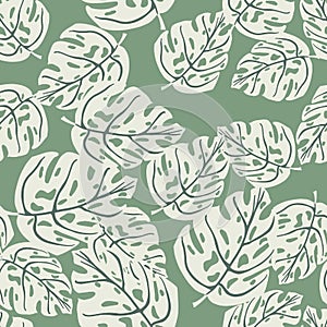 Random seamless flora tropic pattern with doodle monstera leaf shapes. Green pastel background