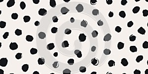 Randomly placed polka dots, hand drawn spots Seamless pattern with doodle circles and geometric shapes. Trendy hand drawn textures