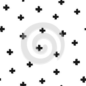 Randomly scattered crosses painted with a rough brush. Seamless pattern.
