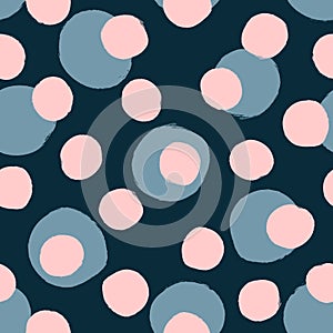 Randomly scattered rounded dots painted with watercolour brush. Seamless pattern for girls.