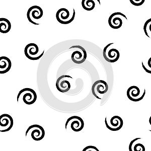 Randomly scattered spirals. Grunge sketched by rough brush. Seamless pattern.