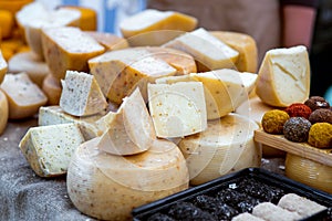 A range of hard cheeses on the table.