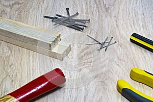 Range of tools for wood - hammer, nails, pliers, screwdriver.