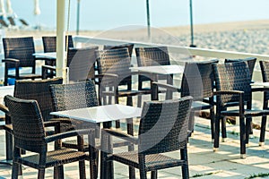 Range of wooden table and black chair for relaxation at restaurant