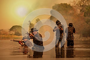 Rangers wade through the water to randomly shoot and attack