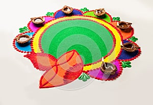 Rangoli design made with colourful powder for Diwali, Pongal, Onam festivals in India