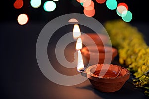 Rangoli of Marigold flowers with Diwali Diya and gift boxes for festival