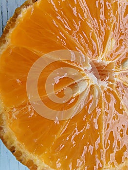 Rangpur lemon, cut in half, full screen, top view, scientific name: Citrus Ã— limonia, fruit of the Rangpur lemon tree,