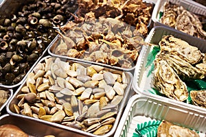 Rapans, oysters and other shellfish on store