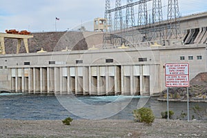 Rapid Changes in Water Level and Do Not Enter the Water sign overlooking the spillway of the Davis Dam in Laughlin, Clark County,