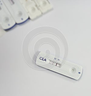 Rapid test cassette for CEA (carcinoembryonic antigen) test showing positive result, tumor marker for Colon cancer. photo