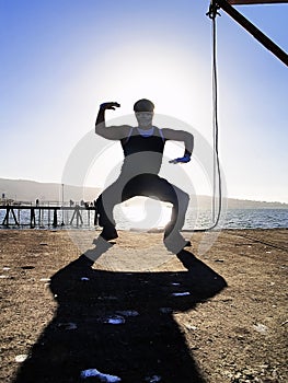 Rapper posing back light