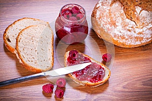 Rapsberry jam with slice of bread