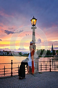 Rapunzel on the castle bridge in Schwerin. Beautiful woman with long blond hair and costume from the fairytale world