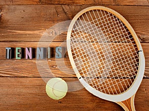 Raquet and ball in wood background photo