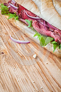 Rare roast beef on a crusty baguette