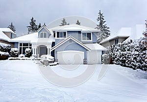 Rare snow storm in Northwest United States with residential home in background