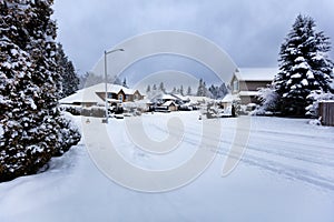 Rare snow storm in Northwest United States with residential homes in background