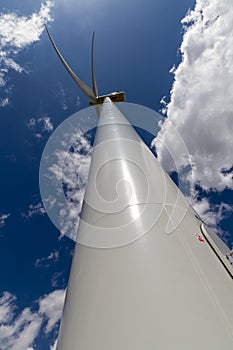 Rare Sunny Side Straight-up Closeup Perspective of a Huge High Tech Industrial Wind Turbine Generating Clean Green Power