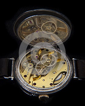 Rare vintage Longines wristwatch movement on black background