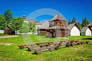 Rare wooden bell tower with folk houses Slovakia