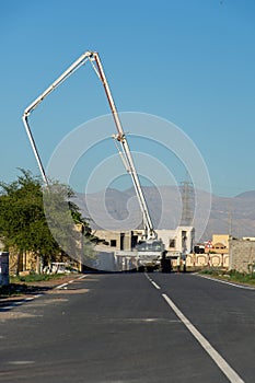 Ras al Khaimah building development building residential house or or apartment building complex with concrete pumper truck on a